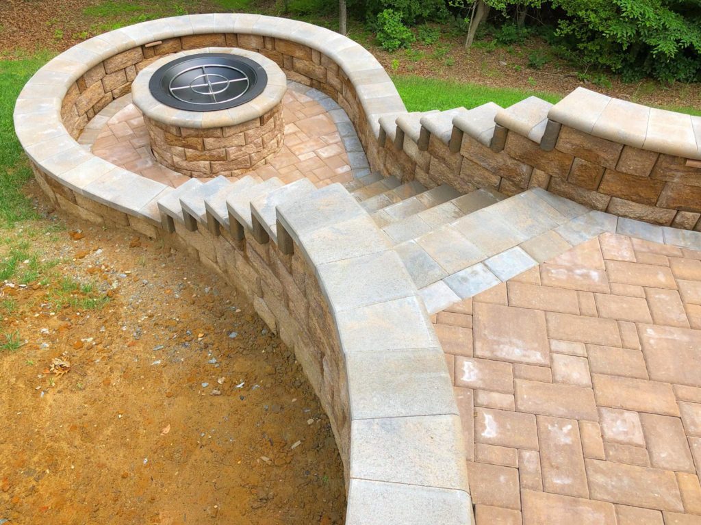 Patio with Fireplace by Stafford Landscape